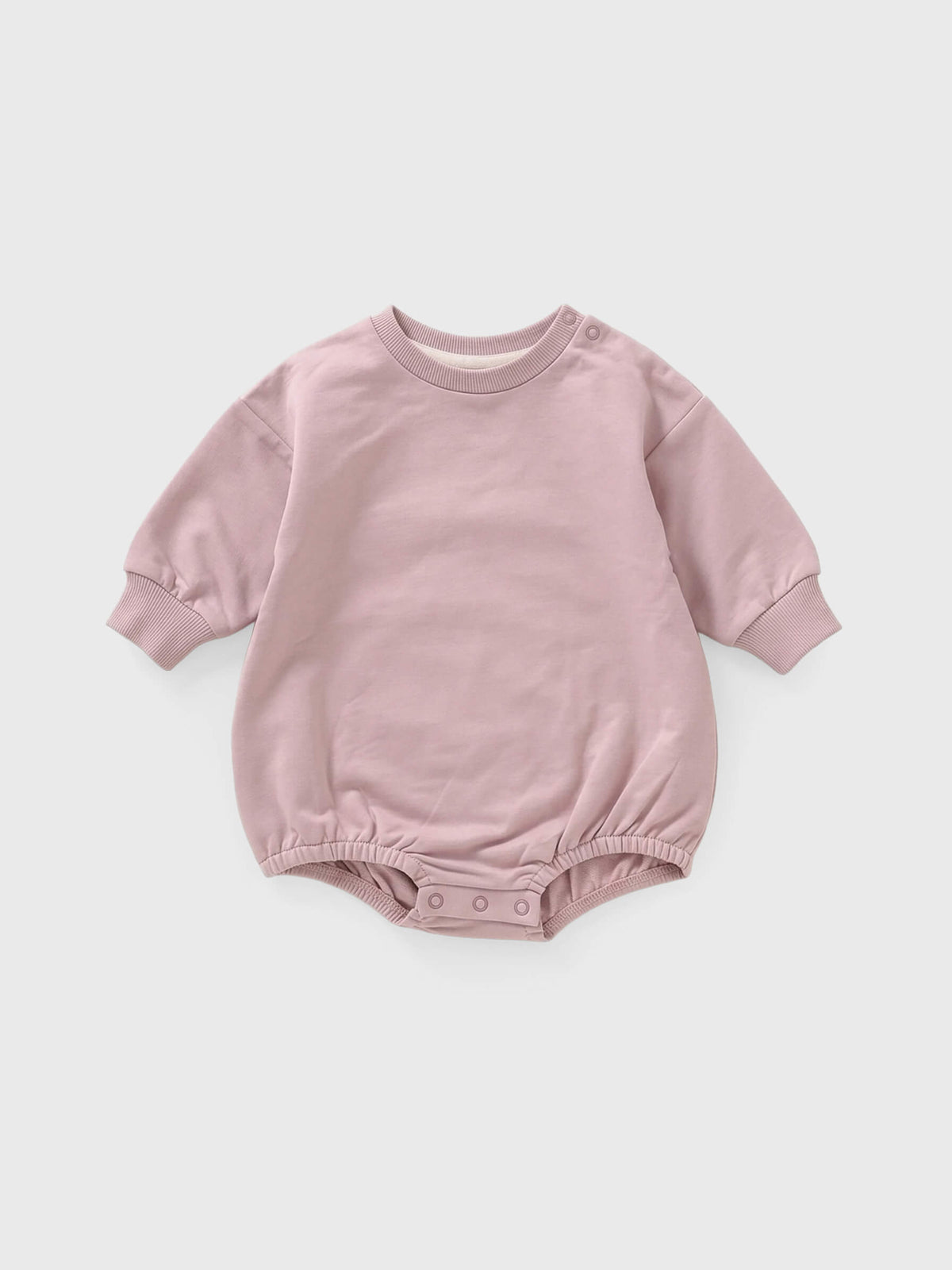Pink baby romper on a white background