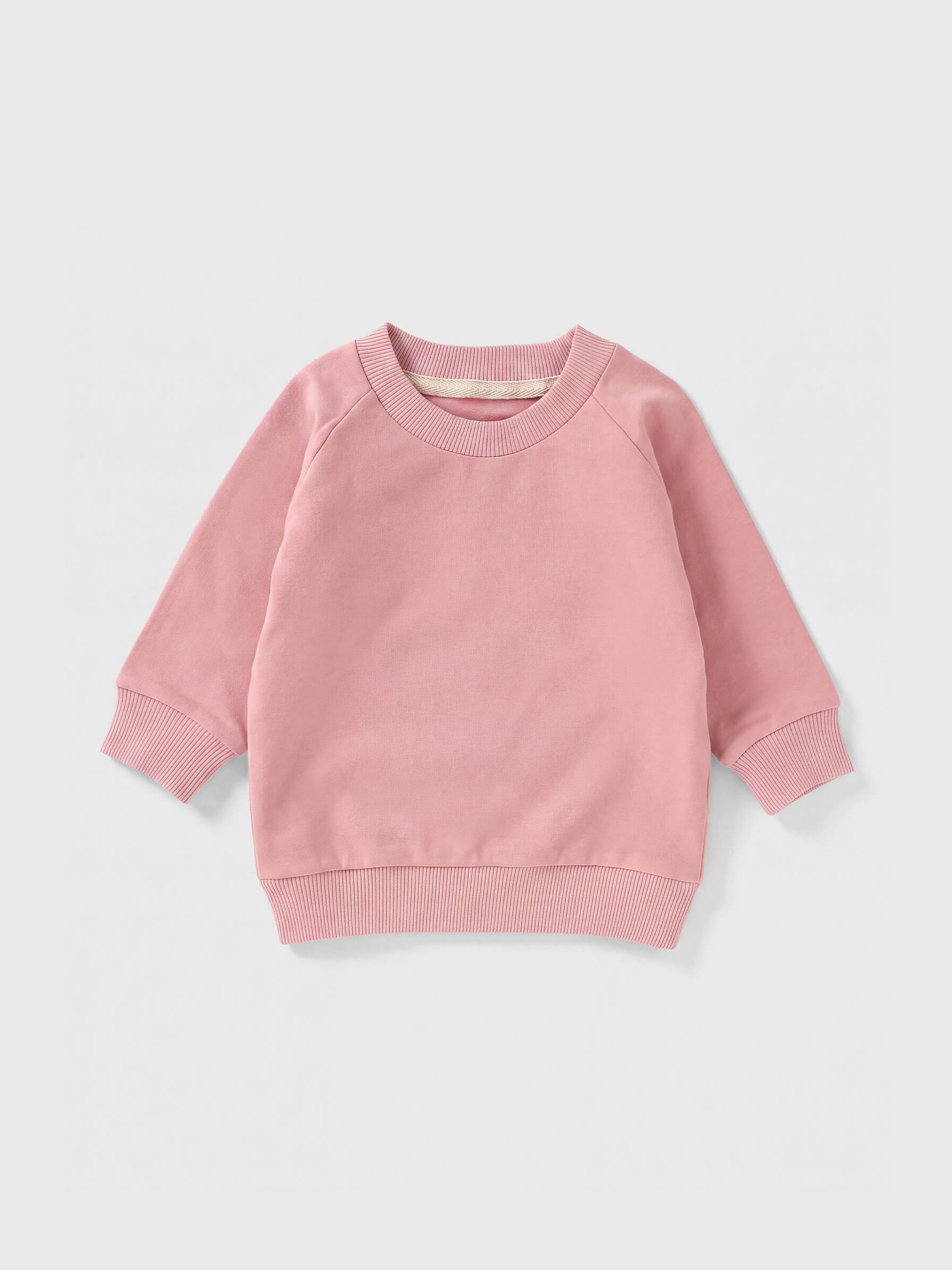 Pink sweatshirt on a light gray background